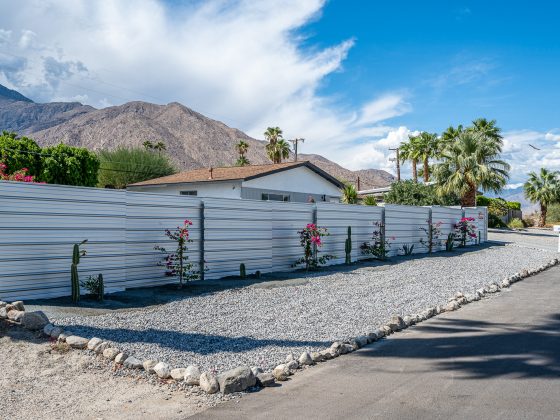 Front of white home with custom steel fence in Palm Springs sold by Joshua Brock